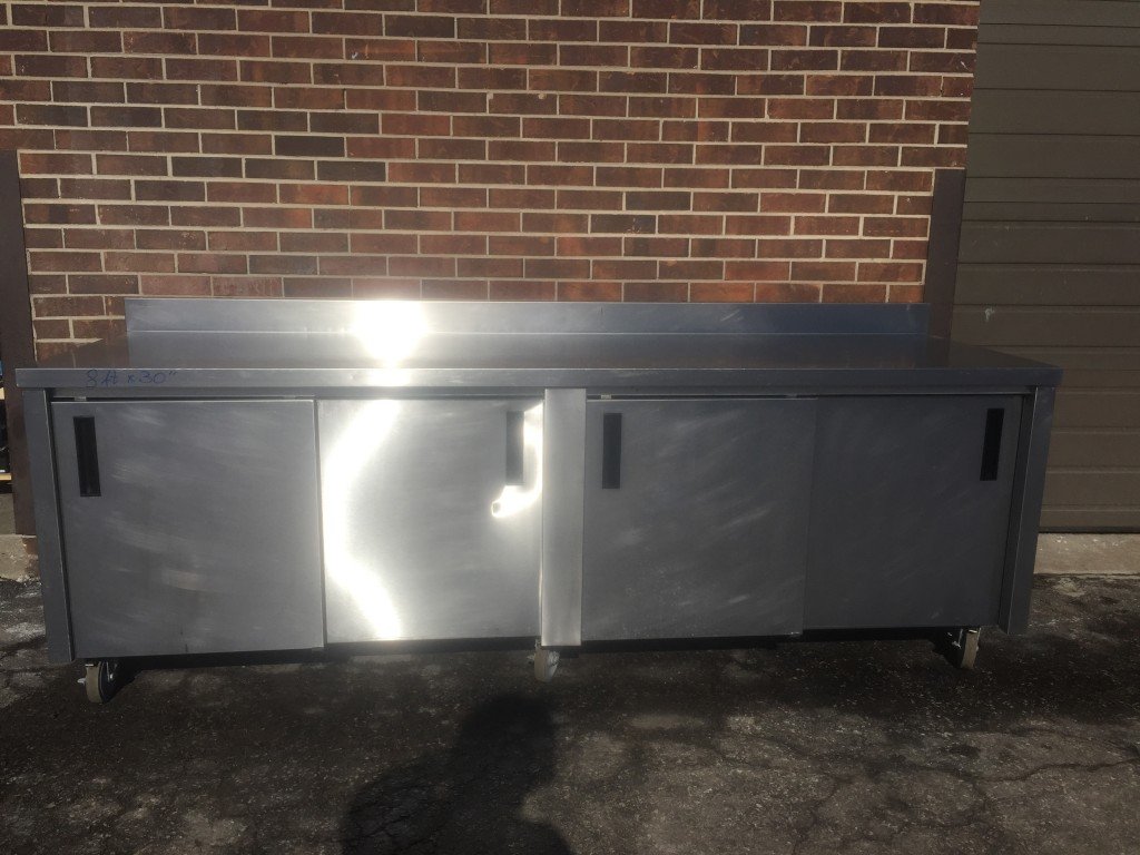 Stainless Steel Work Table On Wheels With Cabinet Base, Sliding Doors and Backsplash